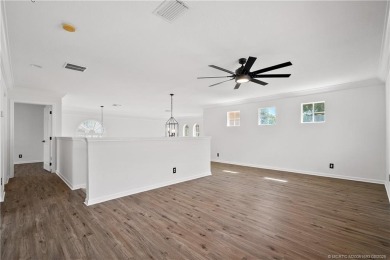 STUNNING 3-bed + bonus loft home in Jensen Beach Country Club on Eagle Marsh Golf Club in Florida - for sale on GolfHomes.com, golf home, golf lot