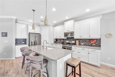 Picture mornings at the breakfast bar, gas flame on, sunlight on Heritage Palms Golf and Country Club in Florida - for sale on GolfHomes.com, golf home, golf lot