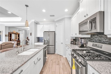 Picture mornings at the breakfast bar, gas flame on, sunlight on Heritage Palms Golf and Country Club in Florida - for sale on GolfHomes.com, golf home, golf lot