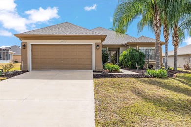 This beautifully maintained original-owner home features a 27' on Eagle Ridge At Spruce Creek Country Club in Florida - for sale on GolfHomes.com, golf home, golf lot