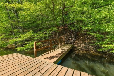 Charming Lakefront Cabin tucked away in the woods overlooking on Hide-A-Way Hills Golf Club in Ohio - for sale on GolfHomes.com, golf home, golf lot