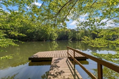 Charming Lakefront Cabin tucked away in the woods overlooking on Hide-A-Way Hills Golf Club in Ohio - for sale on GolfHomes.com, golf home, golf lot