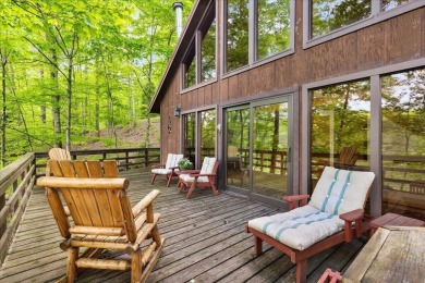 Charming Lakefront Cabin tucked away in the woods overlooking on Hide-A-Way Hills Golf Club in Ohio - for sale on GolfHomes.com, golf home, golf lot