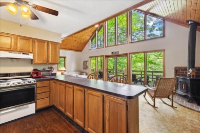 Charming Lakefront Cabin tucked away in the woods overlooking on Hide-A-Way Hills Golf Club in Ohio - for sale on GolfHomes.com, golf home, golf lot
