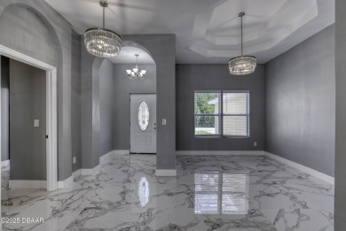 This newly remodeled 3-bedroom, 3-bathroom home in the desirable on The Grand Club - Pine Lakes Course in Florida - for sale on GolfHomes.com, golf home, golf lot