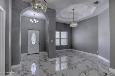 This newly remodeled 3-bedroom, 3-bathroom home in the desirable on The Grand Club - Pine Lakes Course in Florida - for sale on GolfHomes.com, golf home, golf lot