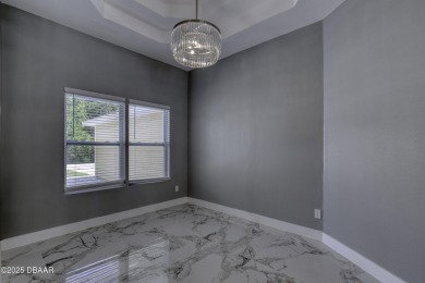 This newly remodeled 3-bedroom, 3-bathroom home in the desirable on The Grand Club - Pine Lakes Course in Florida - for sale on GolfHomes.com, golf home, golf lot