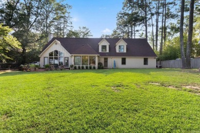 This charming Tudor style home is nestled on a large private lot on Pine Bluff Country Club in Arkansas - for sale on GolfHomes.com, golf home, golf lot