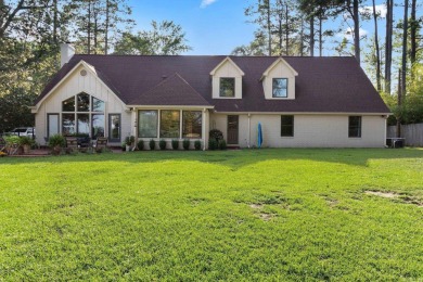 This charming Tudor style home is nestled on a large private lot on Pine Bluff Country Club in Arkansas - for sale on GolfHomes.com, golf home, golf lot