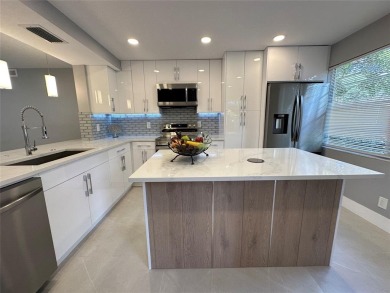 Beautifully renovated 2-bedroom, 2-bath first-floor corner unit on Wynmoor Golf Course in Florida - for sale on GolfHomes.com, golf home, golf lot
