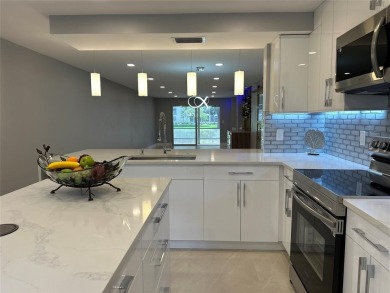 Beautifully renovated 2-bedroom, 2-bath first-floor corner unit on Wynmoor Golf Course in Florida - for sale on GolfHomes.com, golf home, golf lot