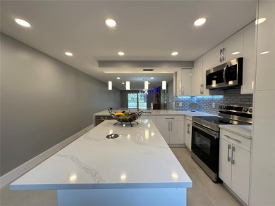 Beautifully renovated 2-bedroom, 2-bath first-floor corner unit on Wynmoor Golf Course in Florida - for sale on GolfHomes.com, golf home, golf lot