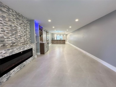 Beautifully renovated 2-bedroom, 2-bath first-floor corner unit on Wynmoor Golf Course in Florida - for sale on GolfHomes.com, golf home, golf lot