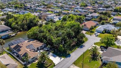 Build Your Waterfront Dream in Paradise! Take this opportunity on Palm Harbor Golf Club in Florida - for sale on GolfHomes.com, golf home, golf lot