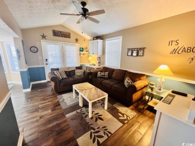 ADORABLE 2 BED/2 BATH BEACH BUNGALOW WITH AN OPEN FLOOR PLAN AND on Midway Par-3 in South Carolina - for sale on GolfHomes.com, golf home, golf lot