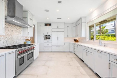 Stunning home situated in a peaceful cul-de-sac is perfectly on Sailfish Point Golf Club, Inc. in Florida - for sale on GolfHomes.com, golf home, golf lot