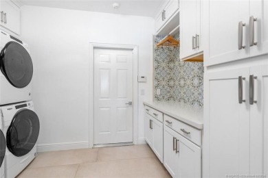 Stunning home situated in a peaceful cul-de-sac is perfectly on Sailfish Point Golf Club, Inc. in Florida - for sale on GolfHomes.com, golf home, golf lot