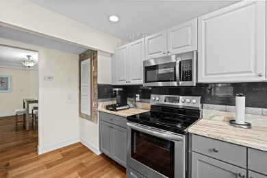 Discover this beautifully updated main floor condo 2-bedroom on Bobby Jones Golf Club in Florida - for sale on GolfHomes.com, golf home, golf lot
