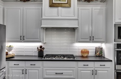 Experience resort style living in this beautifully appointed on Lake Caroline Golf Club in Mississippi - for sale on GolfHomes.com, golf home, golf lot