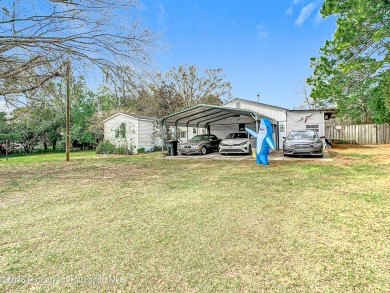 Welcome to this car enthusiasts perfect retreat!! This fantastic on Scotland Yards Golf Club in Florida - for sale on GolfHomes.com, golf home, golf lot