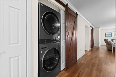 Discover this beautifully updated main floor condo 2-bedroom on Bobby Jones Golf Club in Florida - for sale on GolfHomes.com, golf home, golf lot