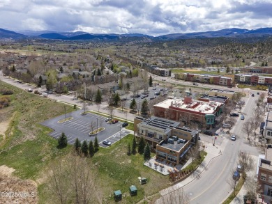 Nestled on a quintessential street in the heart of Eagle Ranch on Eagle Ranch in Colorado - for sale on GolfHomes.com, golf home, golf lot