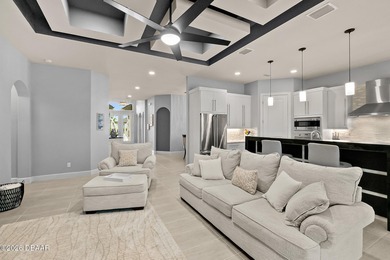 Welcome to this beautifully appointed 3-bedroom, 2-bath home on Plantation Bay Golf and Country Club in Florida - for sale on GolfHomes.com, golf home, golf lot