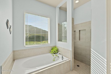 Welcome to this beautifully appointed 3-bedroom, 2-bath home on Plantation Bay Golf and Country Club in Florida - for sale on GolfHomes.com, golf home, golf lot