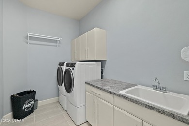 Welcome to this beautifully appointed 3-bedroom, 2-bath home on Plantation Bay Golf and Country Club in Florida - for sale on GolfHomes.com, golf home, golf lot