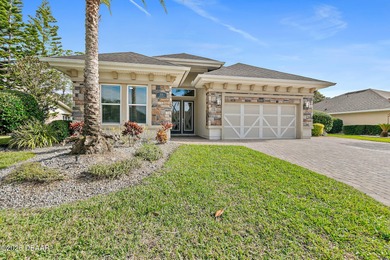 Welcome to this beautifully appointed 3-bedroom, 2-bath home on Plantation Bay Golf and Country Club in Florida - for sale on GolfHomes.com, golf home, golf lot
