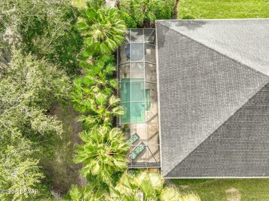 Welcome to this beautifully appointed 3-bedroom, 2-bath home on Plantation Bay Golf and Country Club in Florida - for sale on GolfHomes.com, golf home, golf lot