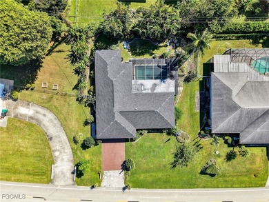 Beautiful 4-bedroom, 2-bath pool home in the highly desirable on Cypress Lake Country Club in Florida - for sale on GolfHomes.com, golf home, golf lot