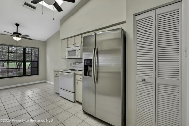 This charming villa, located on the first hole of the Grand on Timber Pines Golf Course in Florida - for sale on GolfHomes.com, golf home, golf lot