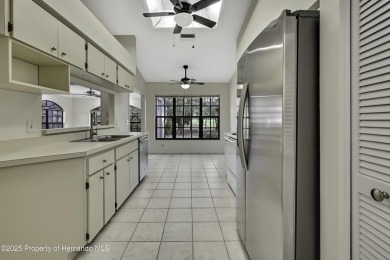 This charming villa, located on the first hole of the Grand on Timber Pines Golf Course in Florida - for sale on GolfHomes.com, golf home, golf lot