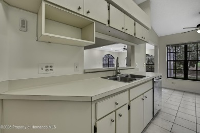 This charming villa, located on the first hole of the Grand on Timber Pines Golf Course in Florida - for sale on GolfHomes.com, golf home, golf lot