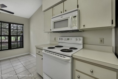 This charming villa, located on the first hole of the Grand on Timber Pines Golf Course in Florida - for sale on GolfHomes.com, golf home, golf lot