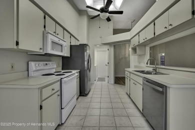 This charming villa, located on the first hole of the Grand on Timber Pines Golf Course in Florida - for sale on GolfHomes.com, golf home, golf lot