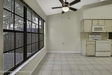 This charming villa, located on the first hole of the Grand on Timber Pines Golf Course in Florida - for sale on GolfHomes.com, golf home, golf lot