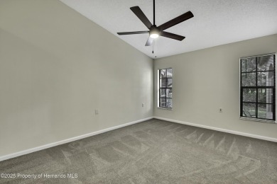 This charming villa, located on the first hole of the Grand on Timber Pines Golf Course in Florida - for sale on GolfHomes.com, golf home, golf lot