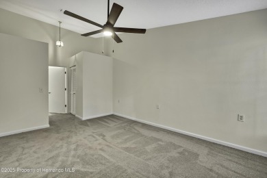 This charming villa, located on the first hole of the Grand on Timber Pines Golf Course in Florida - for sale on GolfHomes.com, golf home, golf lot