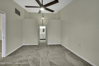 This charming villa, located on the first hole of the Grand on Timber Pines Golf Course in Florida - for sale on GolfHomes.com, golf home, golf lot