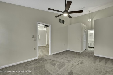 This charming villa, located on the first hole of the Grand on Timber Pines Golf Course in Florida - for sale on GolfHomes.com, golf home, golf lot