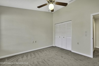 This charming villa, located on the first hole of the Grand on Timber Pines Golf Course in Florida - for sale on GolfHomes.com, golf home, golf lot