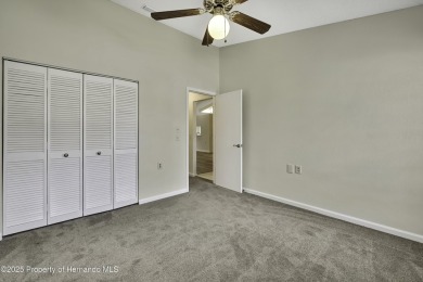 This charming villa, located on the first hole of the Grand on Timber Pines Golf Course in Florida - for sale on GolfHomes.com, golf home, golf lot