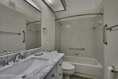 This charming villa, located on the first hole of the Grand on Timber Pines Golf Course in Florida - for sale on GolfHomes.com, golf home, golf lot