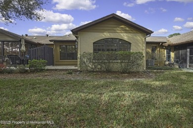 This charming villa, located on the first hole of the Grand on Timber Pines Golf Course in Florida - for sale on GolfHomes.com, golf home, golf lot