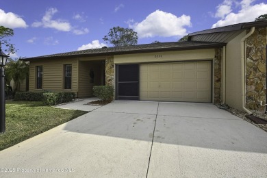 This charming villa, located on the first hole of the Grand on Timber Pines Golf Course in Florida - for sale on GolfHomes.com, golf home, golf lot