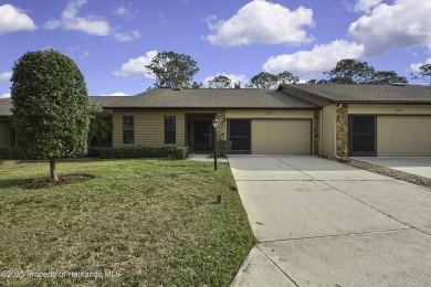 This charming villa, located on the first hole of the Grand on Timber Pines Golf Course in Florida - for sale on GolfHomes.com, golf home, golf lot
