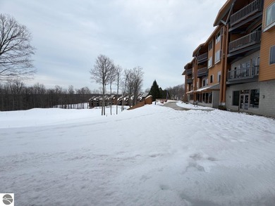 Enjoy views of the 18th hole and pond at the Lodge at Cedar on Schuss Mountain Golf Club in Michigan - for sale on GolfHomes.com, golf home, golf lot