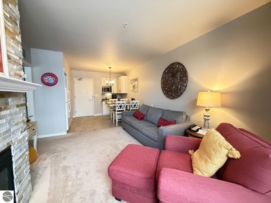 Enjoy views of the 18th hole and pond at the Lodge at Cedar on Schuss Mountain Golf Club in Michigan - for sale on GolfHomes.com, golf home, golf lot